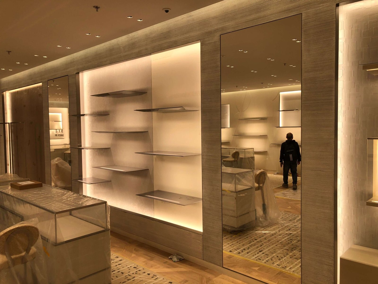 Bespoke metal display rack system by NEXTOP for luxury brand store interior